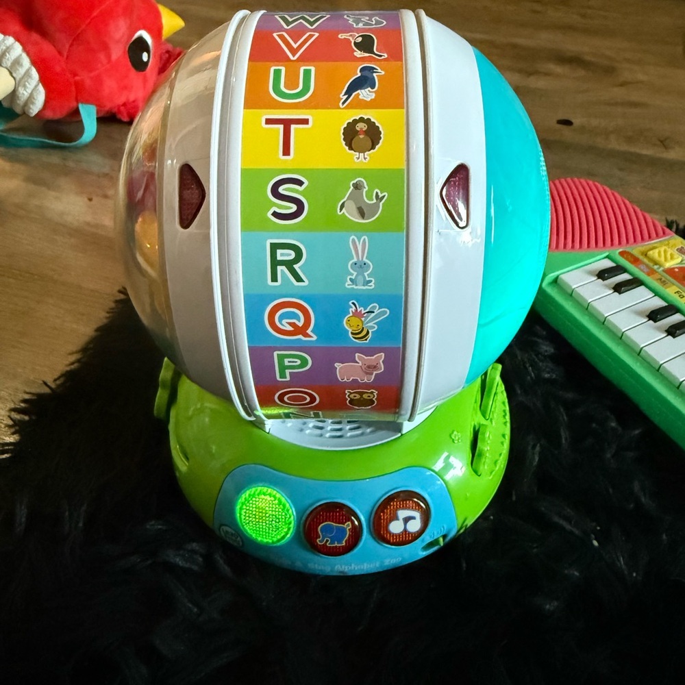 Fisher-Price Alphabet Spin Toy - Green and Blue